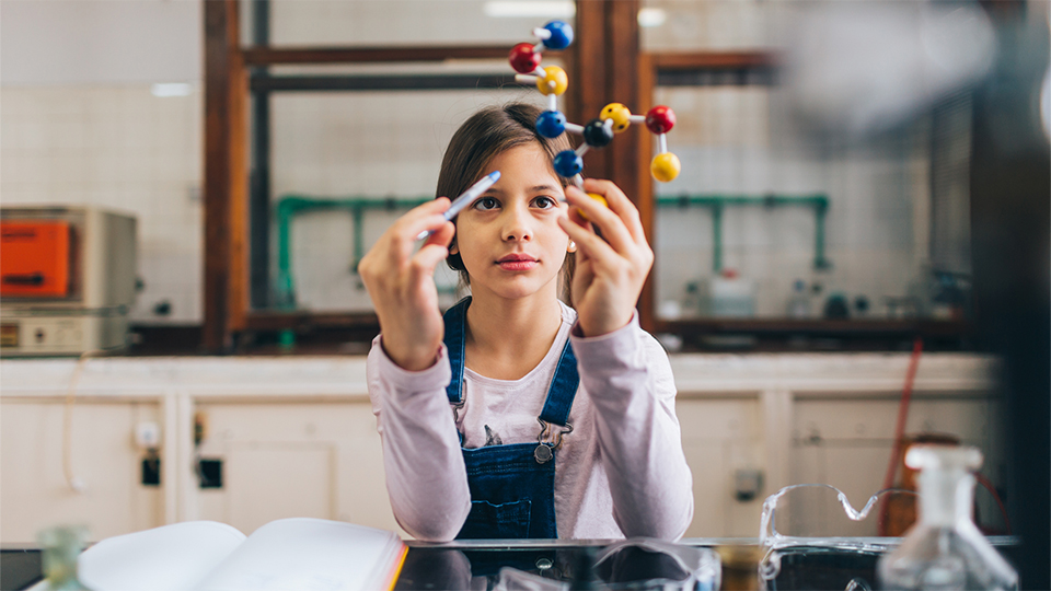 Schoolgirl in a chemical laboratory