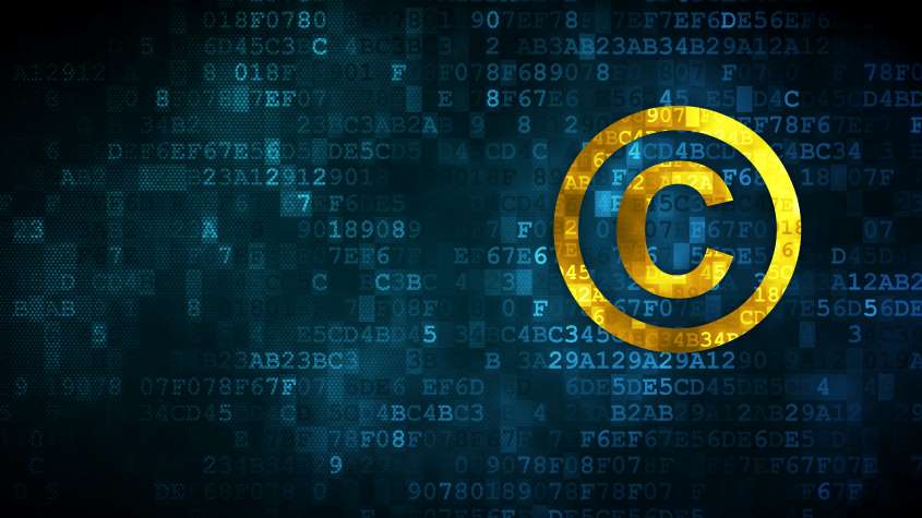 Copyright symbol over a background of code