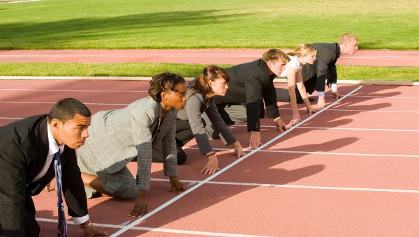People in office outfits preparing to run a race as a symbol of fair competition supported by IP